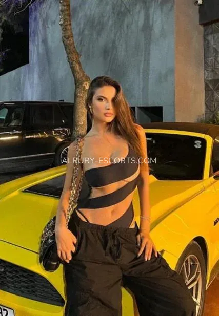 Albury escorts Paige — 1